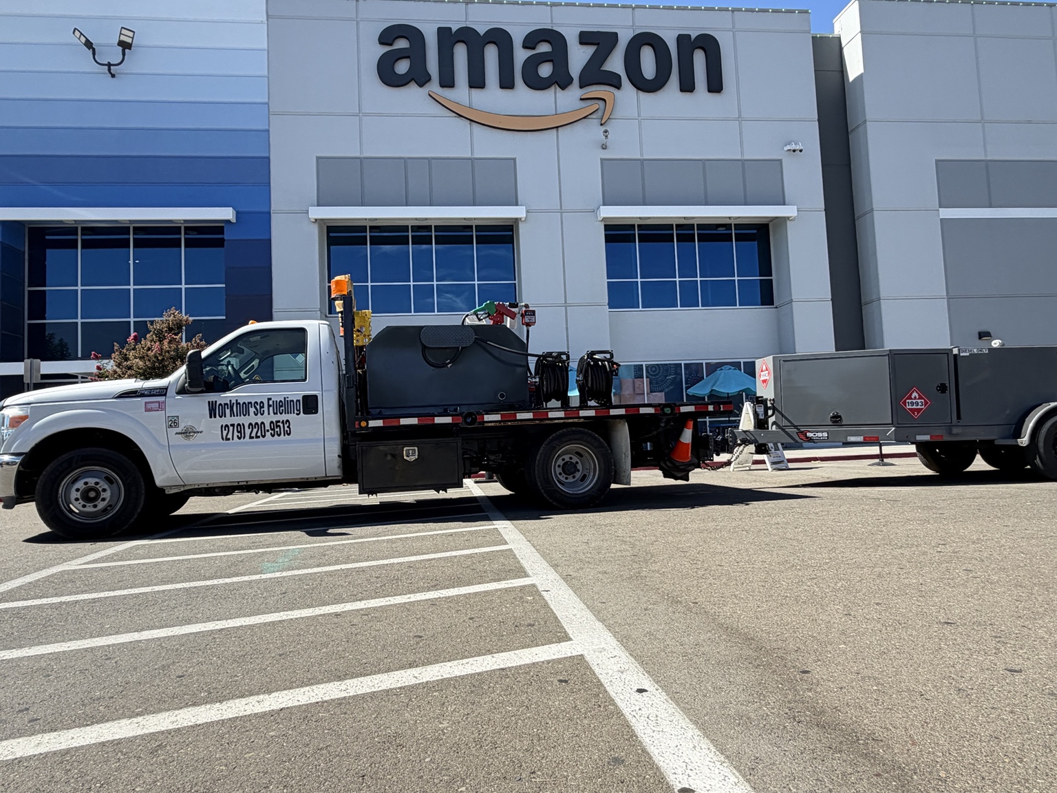 Workhorse Fueling truck and trailer parked outside an Amazon facility